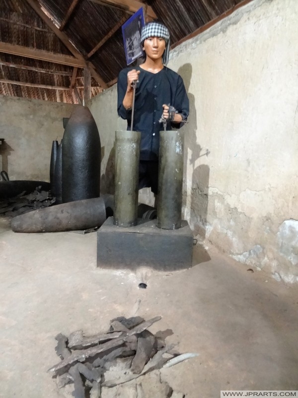 Viet Cong dummy re-using unexploded American munitions (Củ Chi Tunnel, Ben Dinh, Vietnam)
