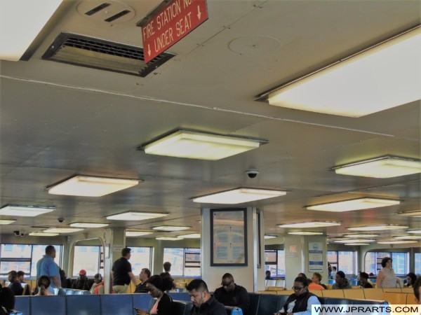 People sitting inside of the Staten Island Ferry (New York, USA)